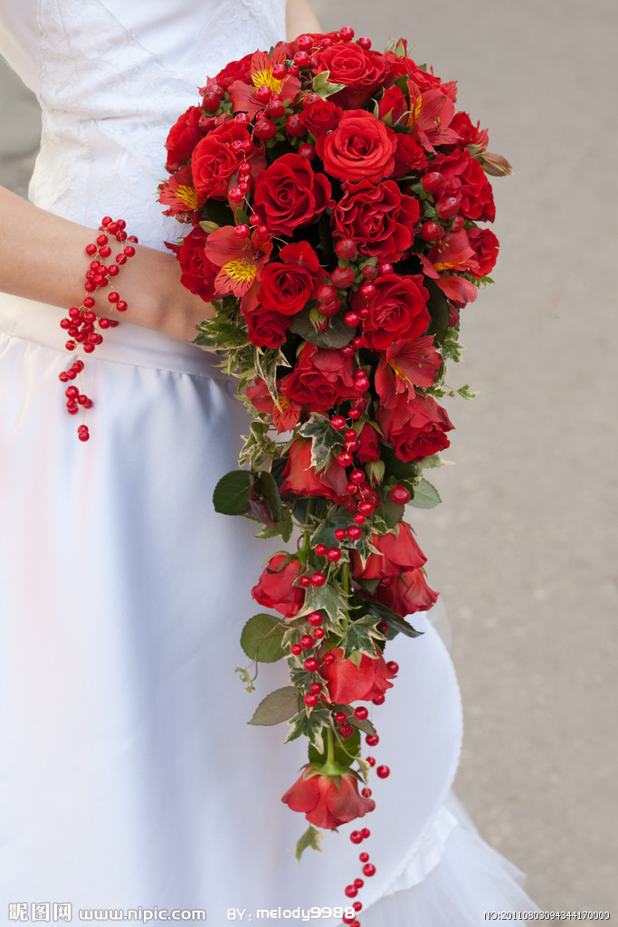 red flowers in wedding bouquet